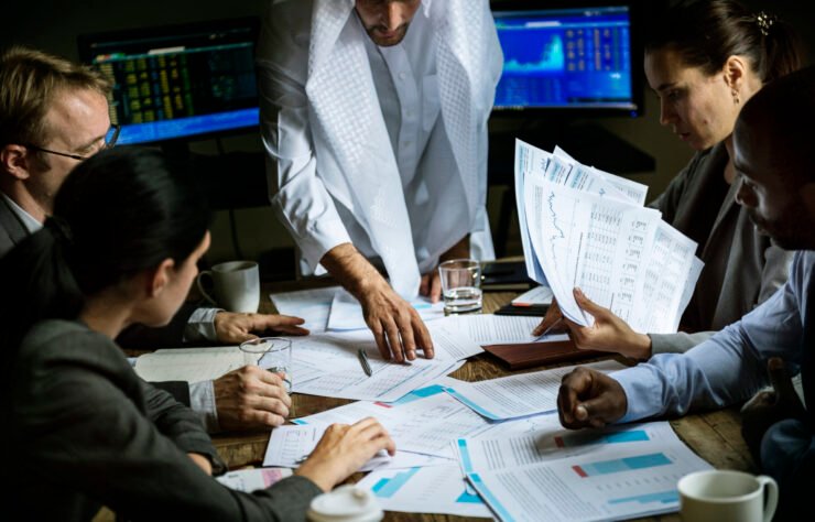 Group of business people working together in a meeting room Group of business people working together in a meeting room